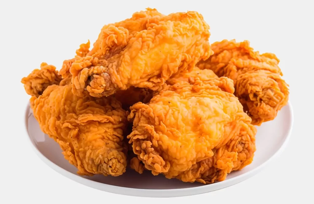 Crispy fried chicken pieces served on a white plate.