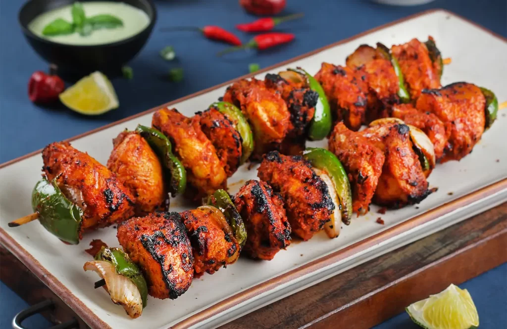 tandoori chicken tikka skewers grilled with capsicum and onions